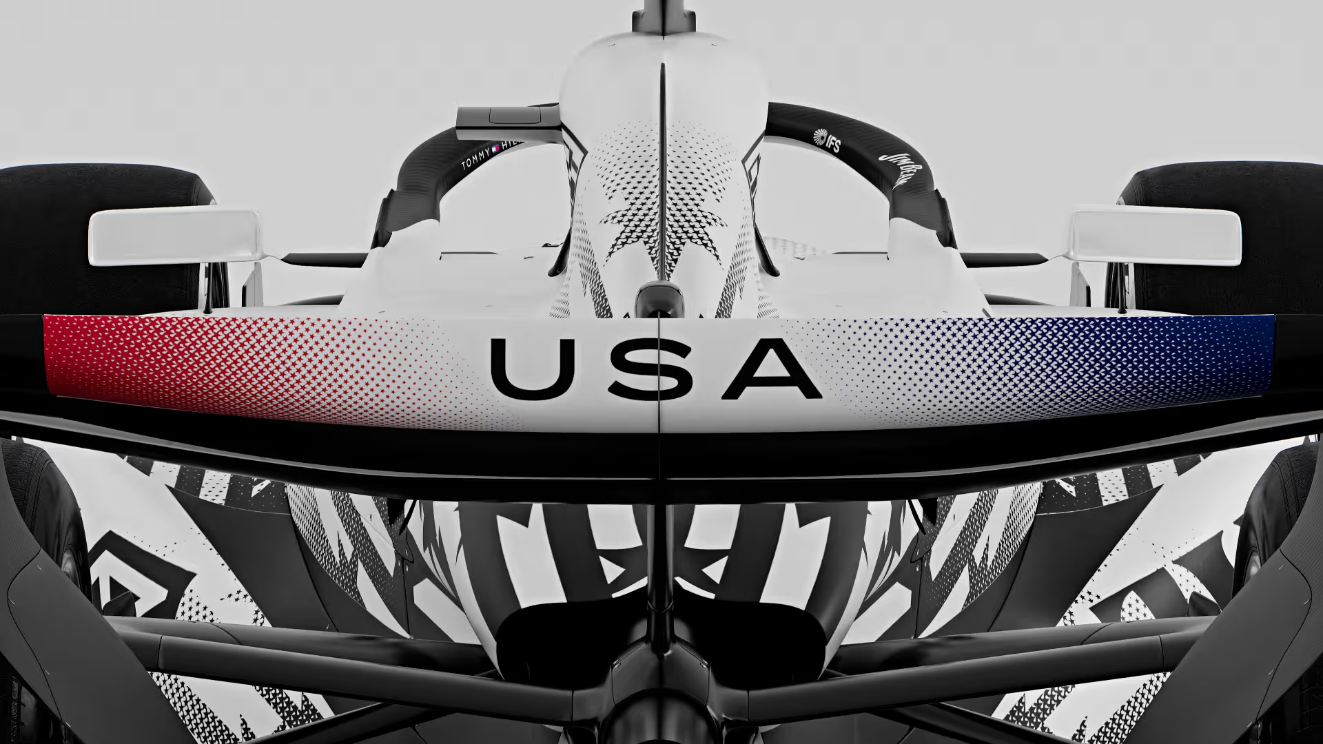 Livery especial Cadillac F1 Team - Esta imagen muestra la parte trasera del coche de carreras Cadillac F1, destacando su diseño especial para el Gran Premio de Miami 2026. El livery incluye los colores de la bandera estadounidense, simbolizando el orgullo nacional en la competición. Un diseño innovador que combina velocidad y estilo.